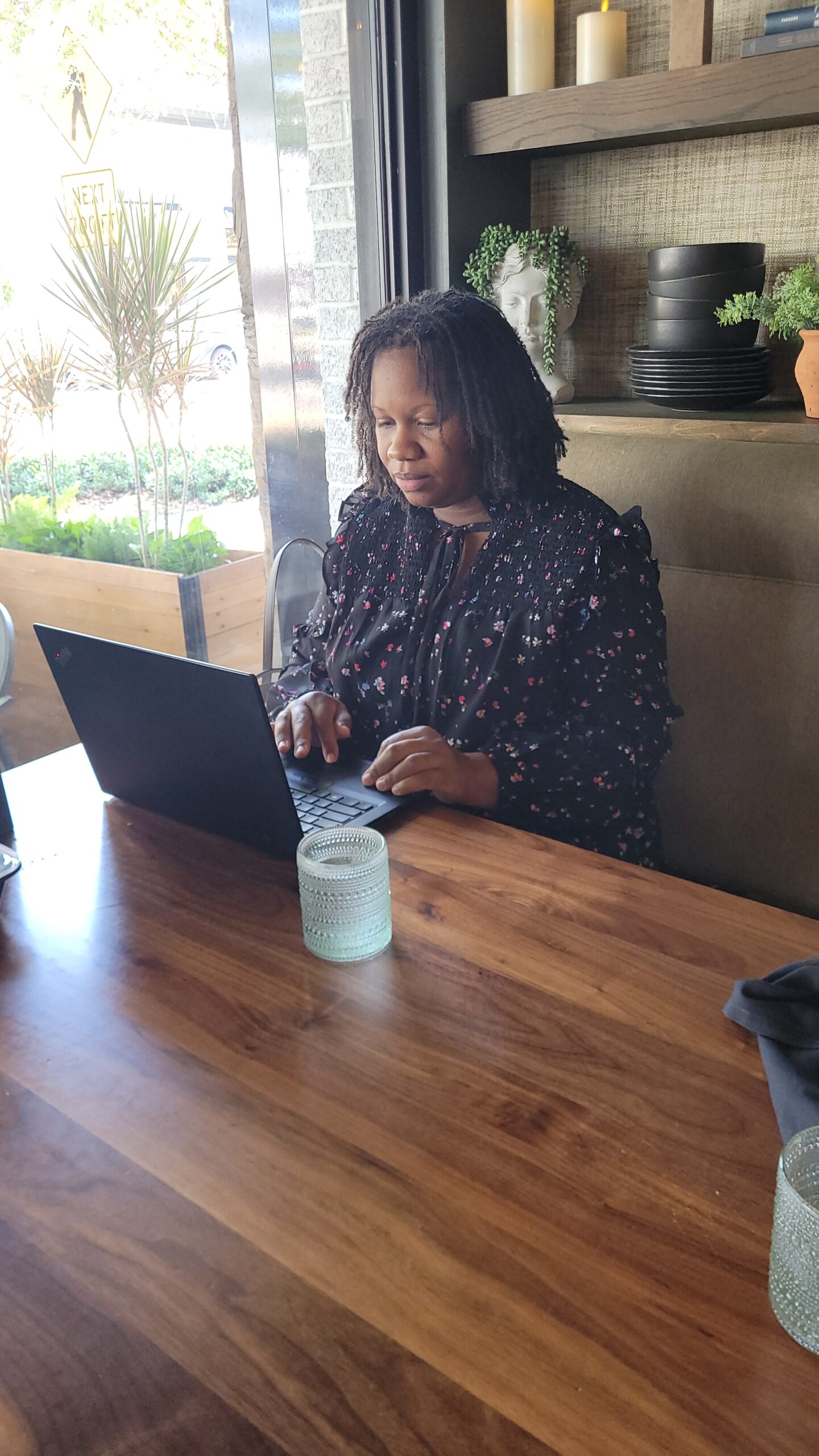 Woman sitting at a table on laptop